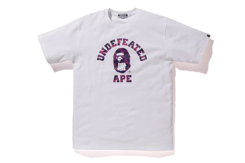 BAPE®️ x UNDEFEATED の強力タッグによるコラボカプセルコレクション第4弾が登場 両者のロゴをミックスしたインパクト抜群のM-65やスウェットセットアップは必見 カリフォルニア州 ロサンゼルス 旗艦店 A BATHING APE®️ BAPE®️ ベイプ ア ベイシング エイプ UNDEFEATED アンディフィーテッド APE HEAD ファイブストライクスロゴ グリーン パープル BAPE®️ CAMO M-65 フーディ Tシャツ スウェットパンツ 6ポケットパンツ James Bond ジェームス・ボンド 転売カルチャー HYPEBEAST ハイプビースト