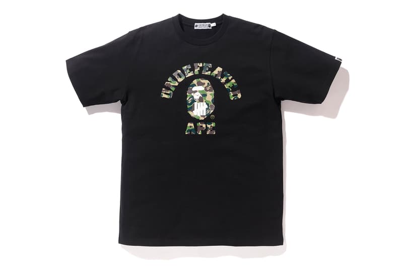 BAPE®️ x UNDEFEATED の強力タッグによるコラボカプセルコレクション第4弾が登場 両者のロゴをミックスしたインパクト抜群のM-65やスウェットセットアップは必見 カリフォルニア州 ロサンゼルス 旗艦店 A BATHING APE®️ BAPE®️ ベイプ ア ベイシング  エイプ UNDEFEATED アンディフィーテッド APE HEAD ファイブストライクスロゴ グリーン パープル BAPE®️ CAMO M-65 フーディ Tシャツ スウェットパンツ 6ポケットパンツ James Bond ジェームス・ボンド 転売カルチャー HYPEBEAST ハイプビースト