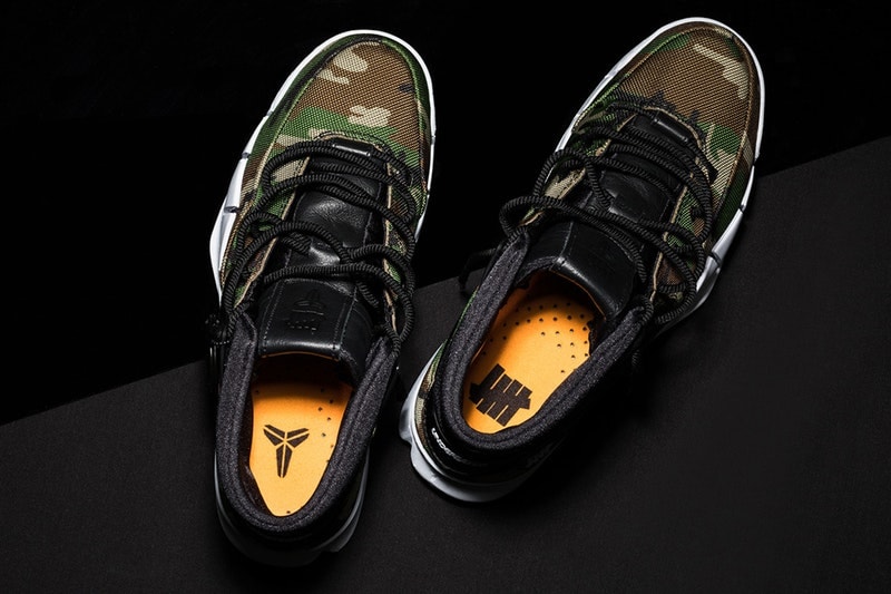 UNDEFEATED x Nike によるコラボ Kobe 1 "Protro" モデルのオフィシャルビジュアルが到着 Air Max DayやNBAのオールスターゲームを間近に控え、スポーツシーンやスニーカーシーンの興隆に更なる拍車をかける〈Nike（ナイキ）〉より、これまでにも度々噂されていたLA発のスニーカーブティック/ブランドの『UNDEFEATED（アンディフィーテッド）』との最新コラボフットウェアのオフィシャルビジュアルが遂に登場。  そのベースモデルとなったのは、一昨年引退したレジェンドNBAプレイヤー Kobe Bryant（コービー・ブライアント）の第1弾シグネチャーモデルとしてリリースされたKobe 1を、〈Nike〉の最新テクノロジーを用いて再構築した“Protoro（Performance Retro）”モデル。アッパーには『UNDEFEATED』らしいカモフラージュ柄を落とし込み、ライニングやサイドのスウッシュ、シュータンなどといったディテールにはブラックカラーを採用。ソールはホワイトカラーのものでデザインを引き締めたストリート色溢れる武骨で男らしい1足に仕上がっている。  この〈Nike〉x『UNDEFEATED』によるコラボ Kobe 1 “Protro”は、海外の『UNDEFEATED』店舗では2月16日（現地時間）より発売開始とのこと。 HYPEBEAST ハイプビースト