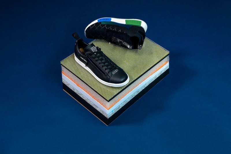 adidas Consortium x mita sneakers が普遍性と進化を表現するコラボスニーカー2型をリリース Stan SmithとNMD TS1 PKに時代を的確に捉える国井栄之のデザインが落とし込まれる 日本を代表するスニーカーアカウント『mita sneakers（ミタスニーカーズ）』と〈adidas（アディダス）〉の最上級プロダクトを展開する〈adidas Consortium〉が再び手を組み、スリーストライプスのブランドの新旧2モデルを採用したコラボパッケージをリリースする。  普遍性を表現するStan Smithは、あえてシンプルなシルエットを際立たせるモノトーンカラーを採用し、シュータンの“CONSORTIUM ADIAS ORIGINALS MITA SNEAKERS Herzo / Tokyo STAN SMITH”や、トゥを飾る〈adidas〉本社と『mita sneakers』のロケーションコードなど、気の利いたプリントが特徴。一方、進化を表現するニューモデル NMD TS1 PKは、プライムニットアッパーの上に『mita』のアイコンであるCHAIN LINK FENCE（金網）をラバープリントで施すことで、全体のホールド性と伸縮性を適度にコントロールする機能デザインに昇華。また、マグネット付きドローコードを搭載したシュータンとヒールタブにも両者のロケーションコードが刻まれているほか、サイドパネルおよびソールユニットでは、ヘルツォーゲンアウラハと東京のアイコンカラーであるブルーとグリーンをクロス オーバーさせることで強い絆の象徴であるConsortiumアイコンを表現している。  スニーカーシーンの限界を押し上げる〈adidas Consortium〉と国井栄之のビジョンが融合したStan SmithとNMD TS1 PKは、前者が18,000円、後者が24,000円（どちらも税抜）で、7月7日（土）より発売開始。  ちなみに、〈adidas〉と言えばYEEZY 500 “Utility Black”に関する有力情報も浮上しているが、果たして……。