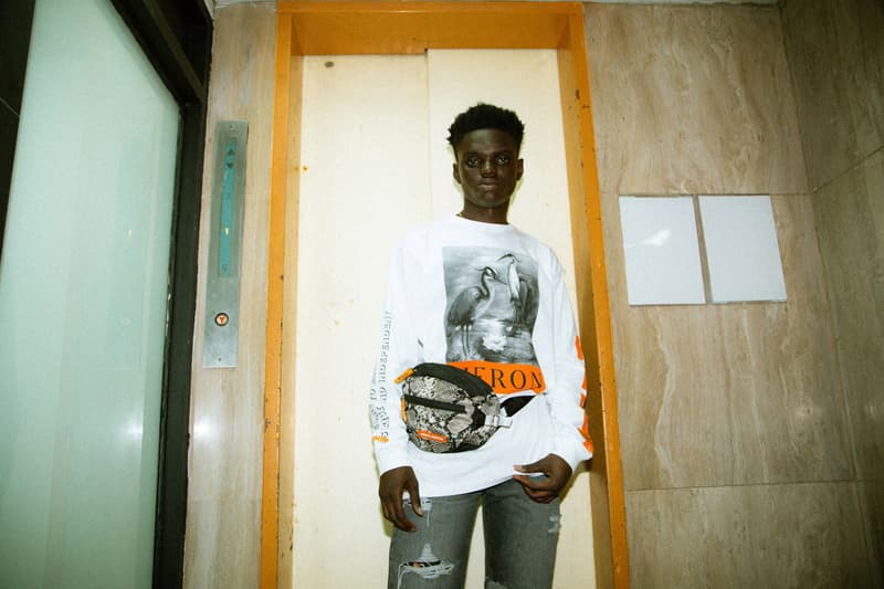 Heron Preston 2018年秋冬コレクションを紐解く HBX の最新エディトリアル ヴァージルやカニエも実力を認めた次世代ストリートの雄にフィーチャー SSENSE エッセンス Heron Preston ヘロン プレストン Kanye West カニエ・ウェスト Virgil Abloh ヴァージル・アブロー HBX ロングスリーブTシャツ アンクル丈ブーツ パイソンプリント ウエストバッグ ミリタリー ワーク HYPEBEAST ハイプビースト