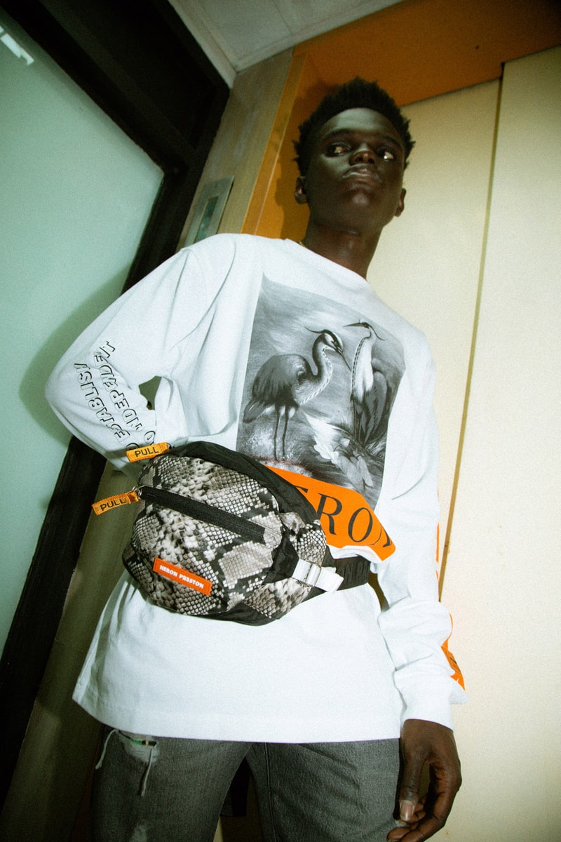 Heron Preston 2018年秋冬コレクションを紐解く HBX の最新エディトリアル ヴァージルやカニエも実力を認めた次世代ストリートの雄にフィーチャー SSENSE エッセンス Heron Preston ヘロン プレストン Kanye West カニエ・ウェスト Virgil Abloh ヴァージル・アブロー HBX ロングスリーブTシャツ アンクル丈ブーツ パイソンプリント ウエストバッグ ミリタリー ワーク HYPEBEAST ハイプビースト