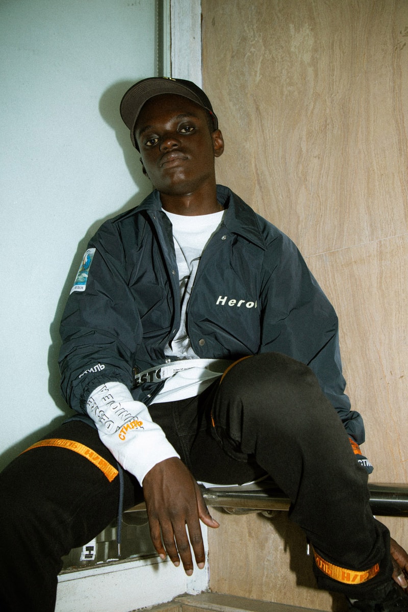 Heron Preston 2018年秋冬コレクションを紐解く HBX の最新エディトリアル ヴァージルやカニエも実力を認めた次世代ストリートの雄にフィーチャー SSENSE エッセンス Heron Preston ヘロン プレストン Kanye West カニエ・ウェスト Virgil Abloh ヴァージル・アブロー HBX ロングスリーブTシャツ アンクル丈ブーツ パイソンプリント ウエストバッグ ミリタリー ワーク HYPEBEAST ハイプビースト