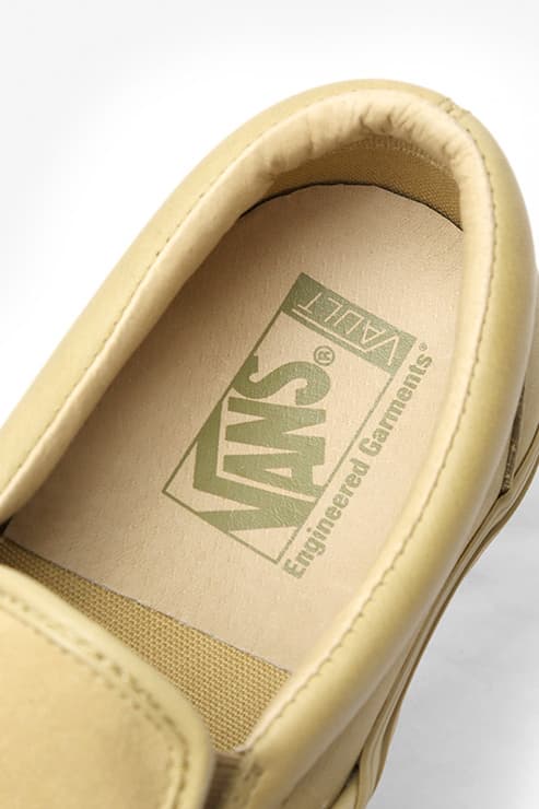 Engineered Garments x Vans Classic Slip-on VLT LX の国内発売が決定 スムースレザーとスエードで前後のパーツを切り替え、さらに左右の足でも非対称に配置したシャープながらも個性的な逸足  先日、『Nepenthes New York』にてリリースされた〈Engineered Garments（エンジニアド ガーメンツ）〉と〈Vans（ヴァンズ）〉の最新コラボスニーカーの国内取扱情報が舞い込んできた。リリースの度に注目を集める〈EG〉x〈Vans〉だが、今回はソールや履き口のクッション部分もアップデートされたClassic Slip-on VLT LXをベースに採用。アッパーを両者のコラボではお馴染みのアシンメトリックデザインとなっており、スムースレザーとスエードで前後のパーツを切り替え、さらに左右の足でも非対称に配置されている。  ピスネーム、ヒールパッチ、インソールのロゴ、アウトソールに至るまで全てワントーンで統一することで洗練されたシャープな印象を放ちつつ、〈EG〉ならではの個性も宿した本作は、ホワイト、ダークネイビー、レッド、カーキの全4色展開で、7月13（金）より『NEPENTHES（ネペンテス）』各店にて発売開始。価格は、13,000円（税抜）となっている。  あわせて、ありそうでないデザインが目を奪う〈Vans〉x『size?（サイズ）』のStyle 36 “Pony Hair”パックもチェックしてみてはいかが？