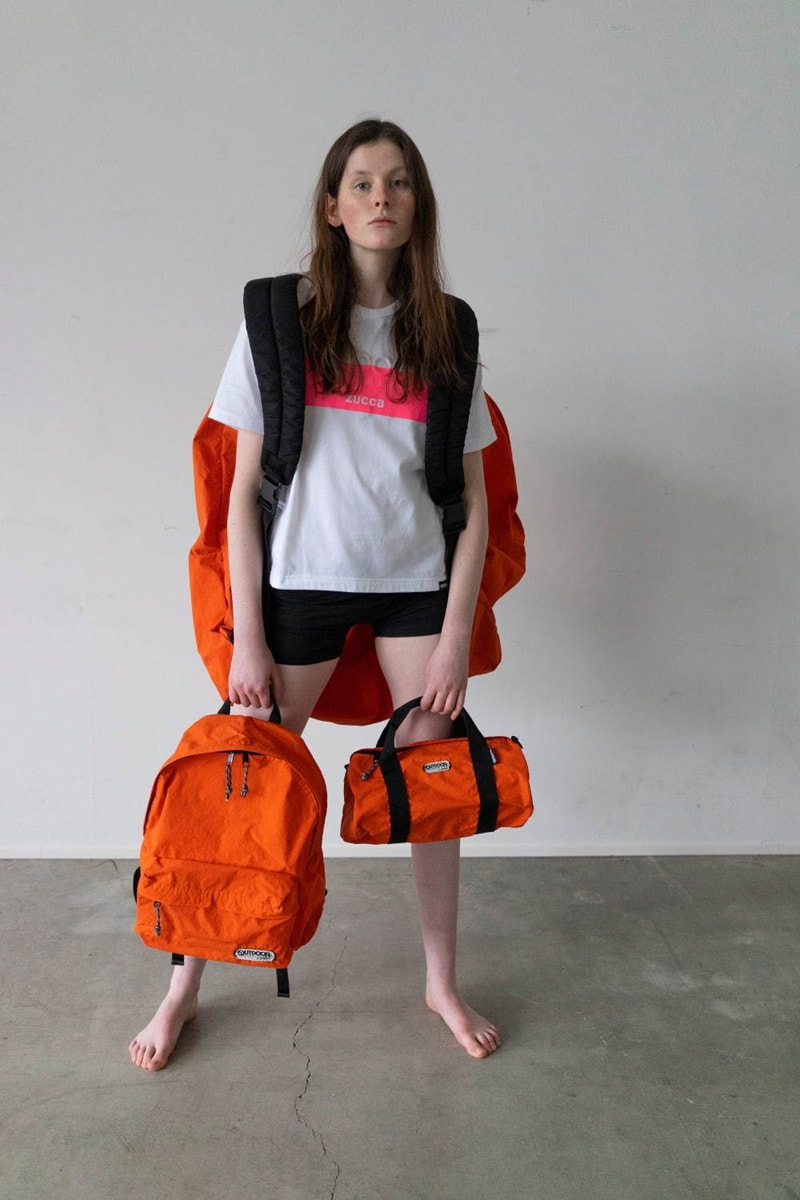 アウトドアプロダクツ ズッカ が初コラボでバッグとTシャツをリリース Zucca x Outdoor Products Collection Collab T-shirts Standard Asymmetric Diagonal Cut Neon Orange Black Light Brown Duffels Rucksacks "452U" "231LRG" "Konbu-N" Nylon backpack
