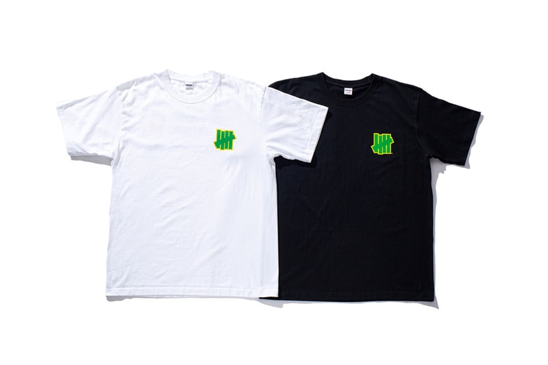 アンディフィーテッドがナイキ ダンク ブラジルを記念したTシャツをリリース UNDEFEATED が Nike Dunk Low “Brazil” の復刻リリースを記念したスペシャルTシャツをリリース