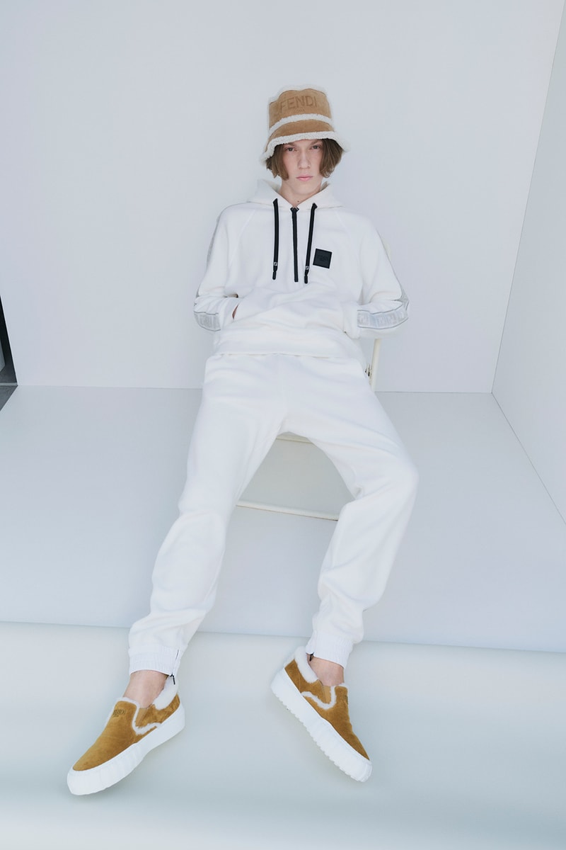 FENDI がサステナブルに焦点を当てたスキーウェアコレクションを発表 Fendi Releases Its 2021 Skiwear Line women men outwear accessories ski trip sustainability regenerated duck feathers aquafil econyl yarn jacket tracksuits karligraphy monogram FF logo down pants weatherproof heat tech skis helmet goggles boots release info 