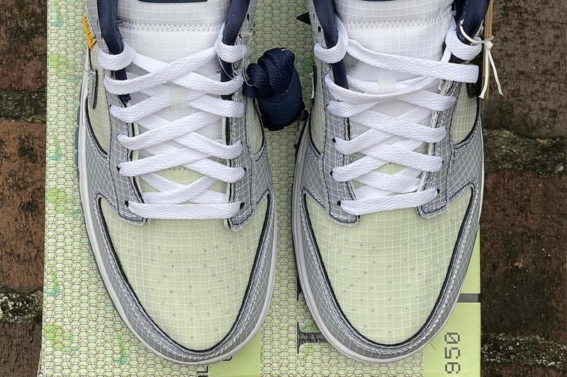 フライトにインスパイアされたユニオン x ナイキ ダンク ロー “Midnight Navy” のビジュアルが浮上 Detailed Look at the Union x Nike Dunk Low Midnight Navy First Look Release date info grid pattern frontman logo silver grey reflective flight tag baggage passport plane un la green mint blue
