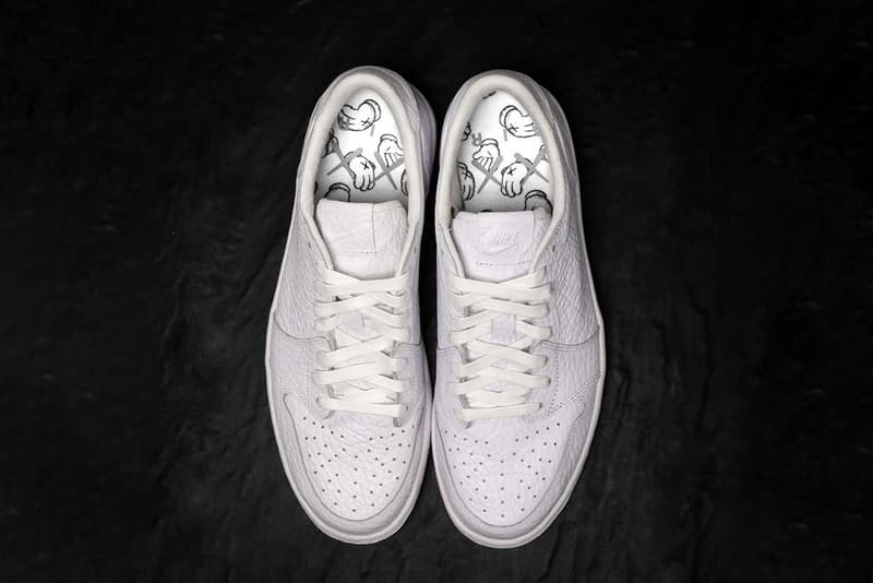 カウズ x ジョーダンブランドによる幻のコラボ エアジョーダン 1 ローをチェック Kaws x Jordan Brand 1 Low Sample Closer Look English Sole sneakers footwear kicks artwork AJ1