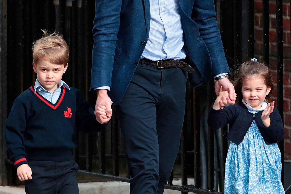 Princess Charlotte of Cambridge (R) waves at the media as she is led in with her brother Prince George of Cambridge (L) by their father Britain's Prince William, Duke of Cambridge, (C) at the Lindo Wing of St Mary's Hospital in central London, on April 23, 2018, to visit Catherine, Duchess of Cambridge, and their new-born brother, the Duke and Duchesses third child. - Kate, the wife of Britain's Prince William, has given birth to a baby son, Kensington Palace announced Monday. "Her Royal Highness The Duchess of Cambridge was safely delivered of a son at 11:01 (1001 GMT)," the palace said in a statement. The baby boy weighs eight pounds and seven ounces (3.8 kilogrammes). (Photo by Daniel LEAL-OLIVAS / AFP) (Photo credit should read