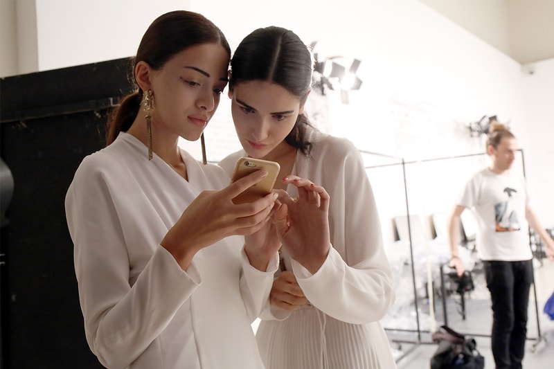 Models At Backstage Using Mobile Phone