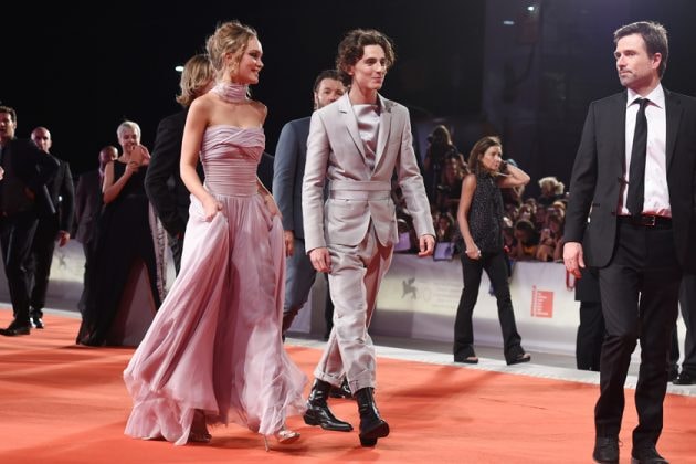 lily-rose depp timothee chalamet the king venice red carpet dress suits