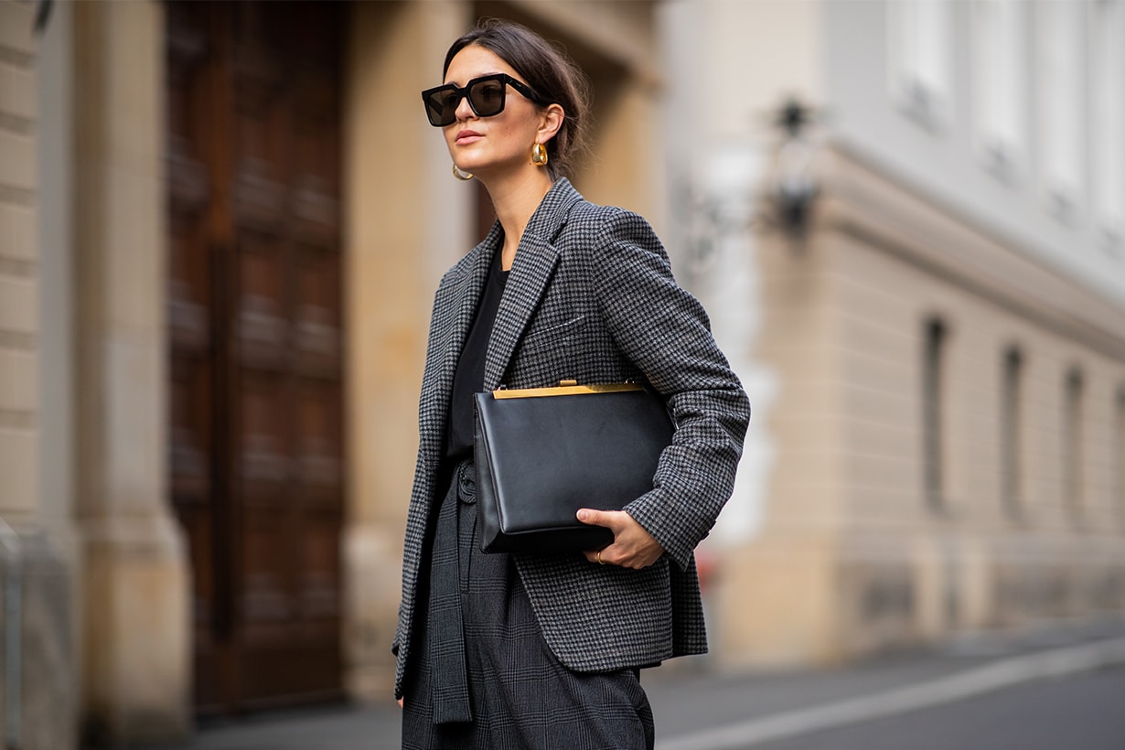Anais Eleni is seen wearing grey &other stories blazer, grey high waist Sea NY pants, black Massimo Dutti boots, Celine bag and sunglasses on November 10, 2018 in Berlin, Germany