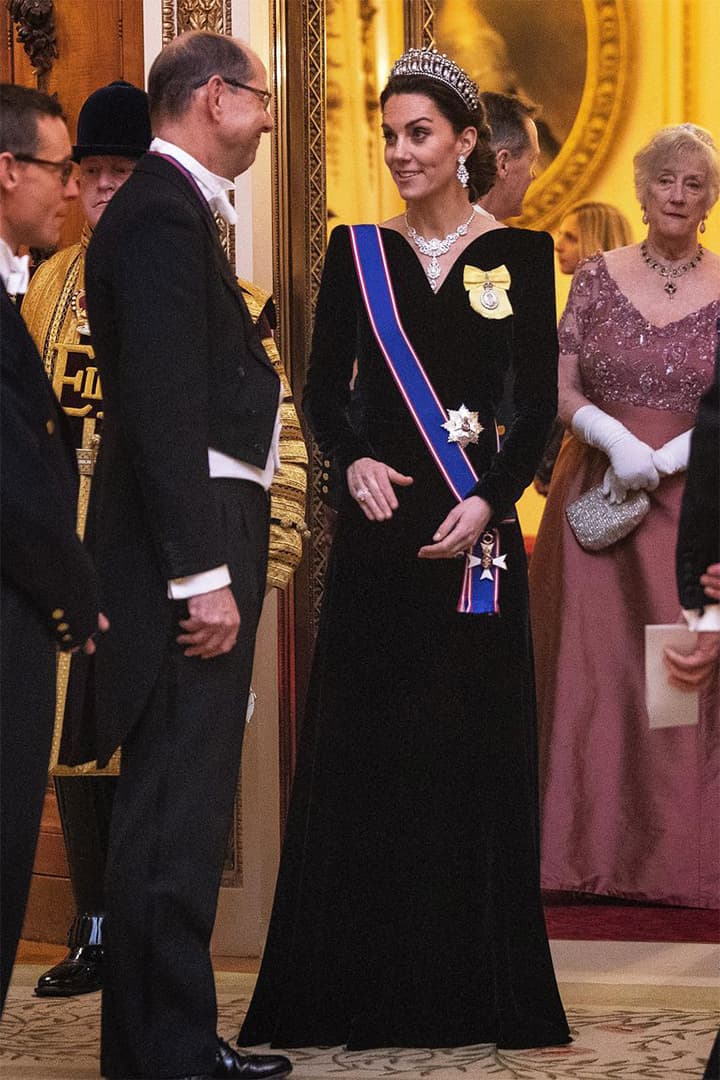 Catherine, Duchess of Cambridge talks to guests at an evening reception for members of the Diplomatic Corps at Buckingham Palace