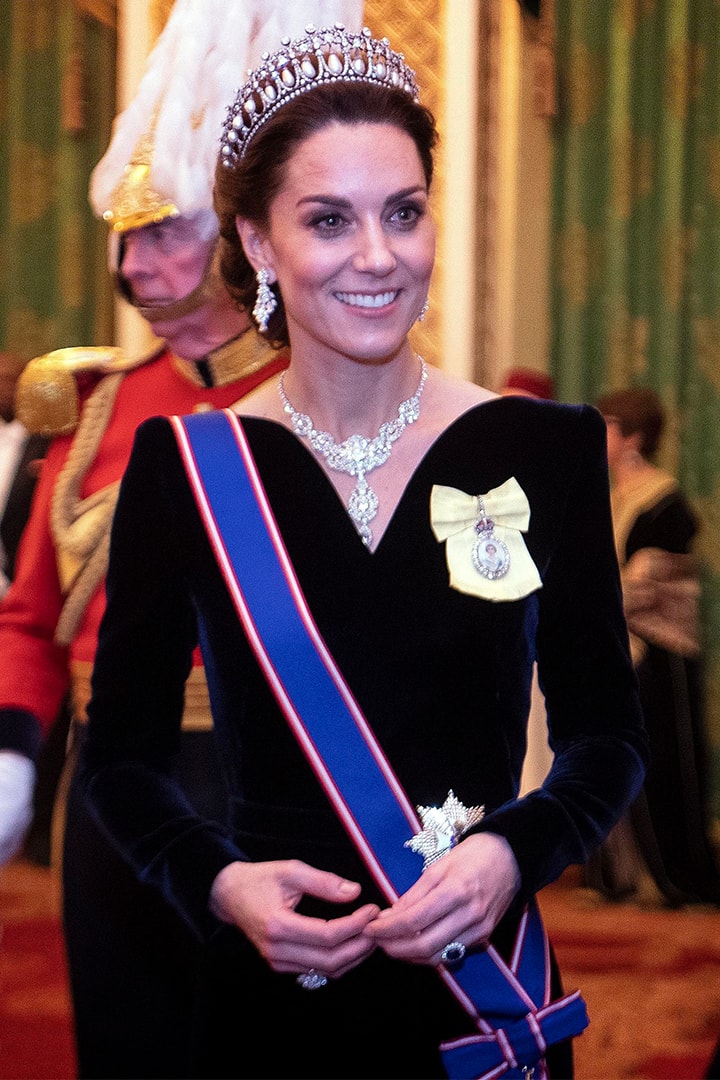 Catherine, Duchess of Cambridge talks to guests at an evening reception for members of the Diplomatic Corps at Buckingham Palace