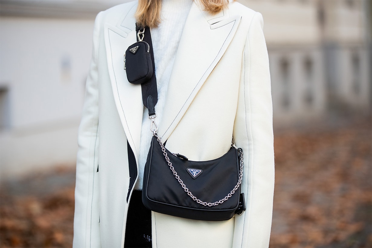 Sonia Lyson is seen wearing white wool coat Lala Berlin, Prada bag, &other Stories jumper on December 05, 2019 in Berlin, Germany.