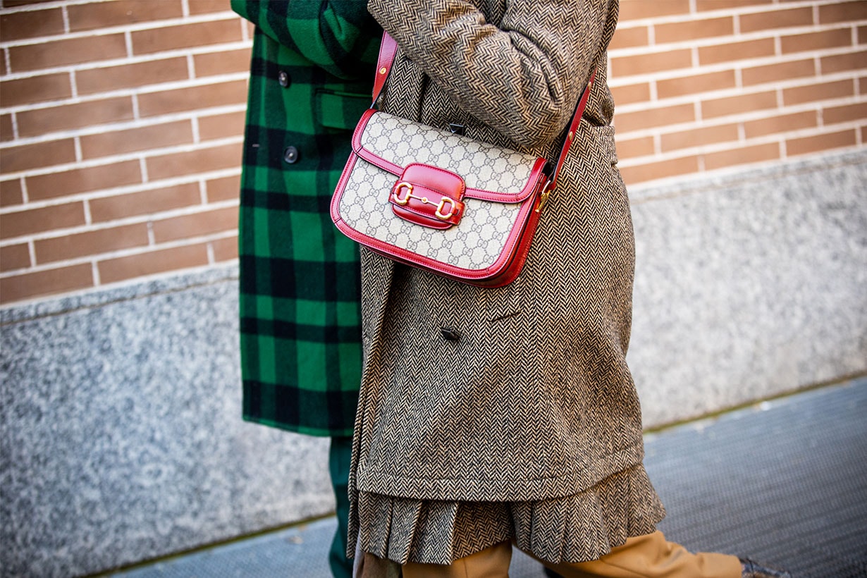 A guest, Gucci bag details, is seen outside the Fendi show during the Milan Men's Fashion Week on January 13, 2020 in Milan