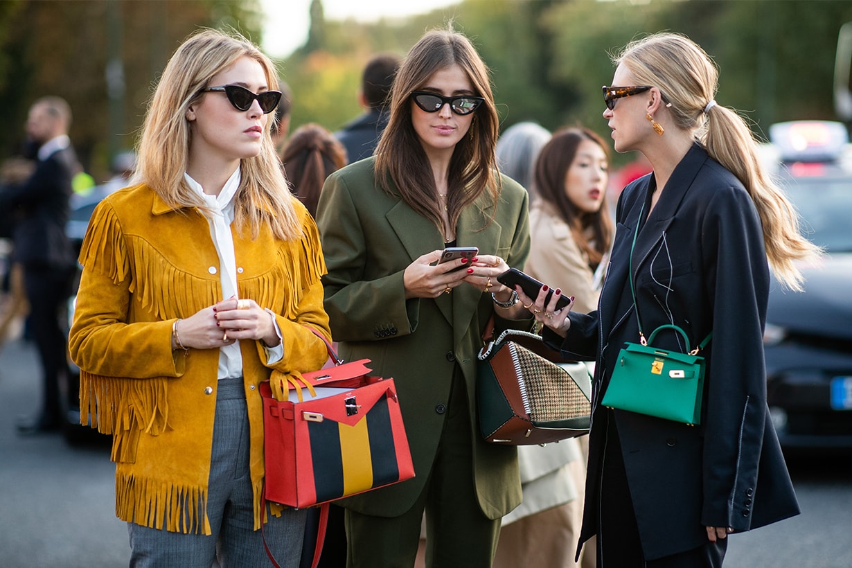 Annabel Rosendahl and Darja Barannik and Tine Andrea wearing green Hermes bag is seen outside Hermes during Paris Fashion Week Womenswear Spring/Summer 2019