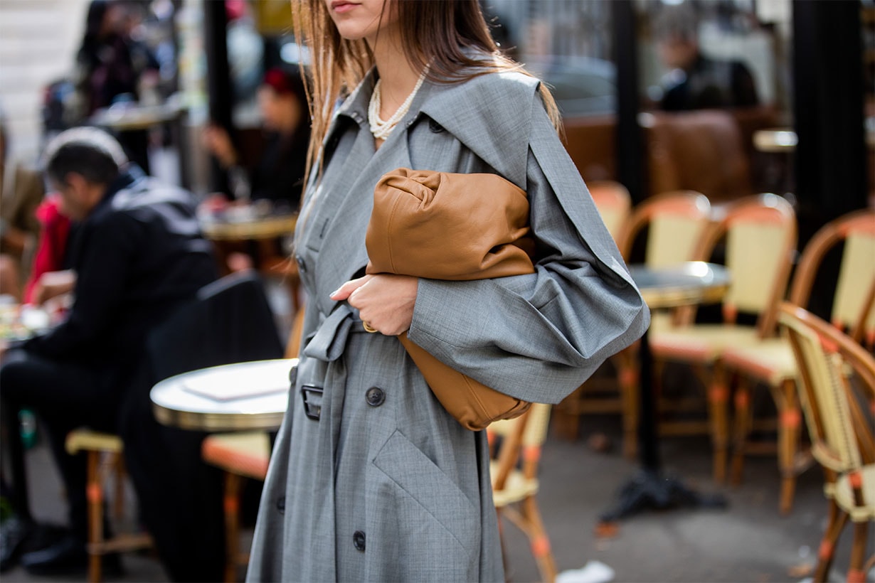 Beatrice Gutu seen wearing Bottega Veneta pouch bag, grey trench coat outside Altuzarra during Paris Fashion Week Womenswear Spring Summer 2020 on September 28, 2019 in Paris, France.