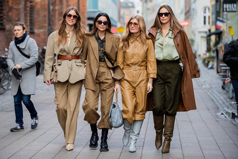 Trine Kjaer wearing beige belted blazer and pants, Funda Christophersen wearing brown suit, Bottega Veneta bag, Mie Jul wearing beige overall and Mathilde Goehler wearing brown jacket, olive pants, boots, button shirt seen outside Mark Kenly Domino Tanduring Copenhagen Fashion Week Autumn/Winter 2020 Day 2 on January 29, 2020 in Copenhagen, Denmark.