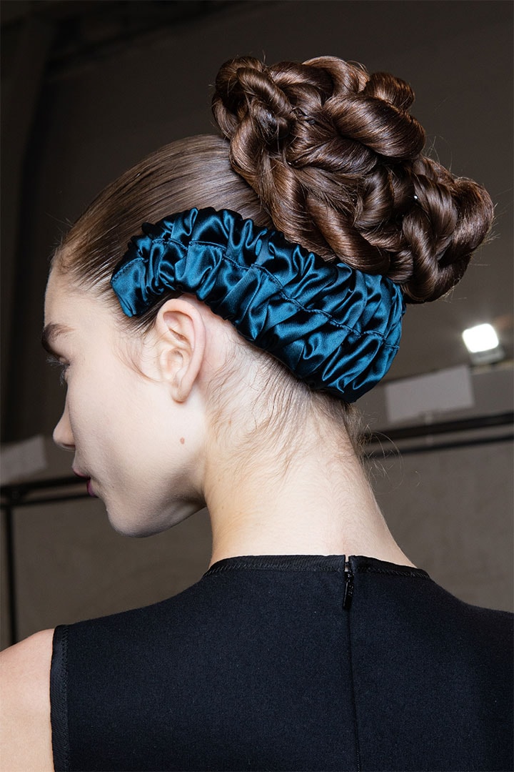 Megan Roche, hair detail, is seen backstage at the Fendi fashion show on February 20, 2020 in Milan, Italy.