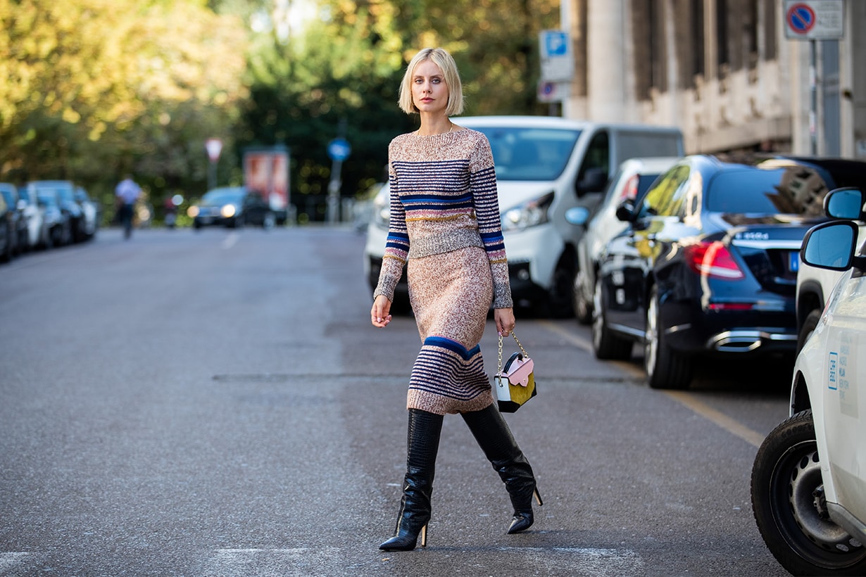 Lisa Hahnbueck is seen wearing See by Chloe skirt and knit set, Jimmy Choo Mavis boots, Manu Atelier bag during Milan Fashion Week Spring/Summer 2020 on September 19, 2019 in Milan, Italy.