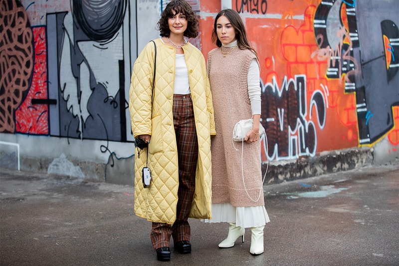 Alyssa Coscarelli seen wearing beige puffer coat, checkered pants, Loewe bag and Lauren Caruso wearing micro bag, sleeveless knit dress outside Rodebjer during Copenhagen Fashion Week Autumn/Winter 2020 Day 3 on January 30, 2020 in Copenhagen, Denmark.