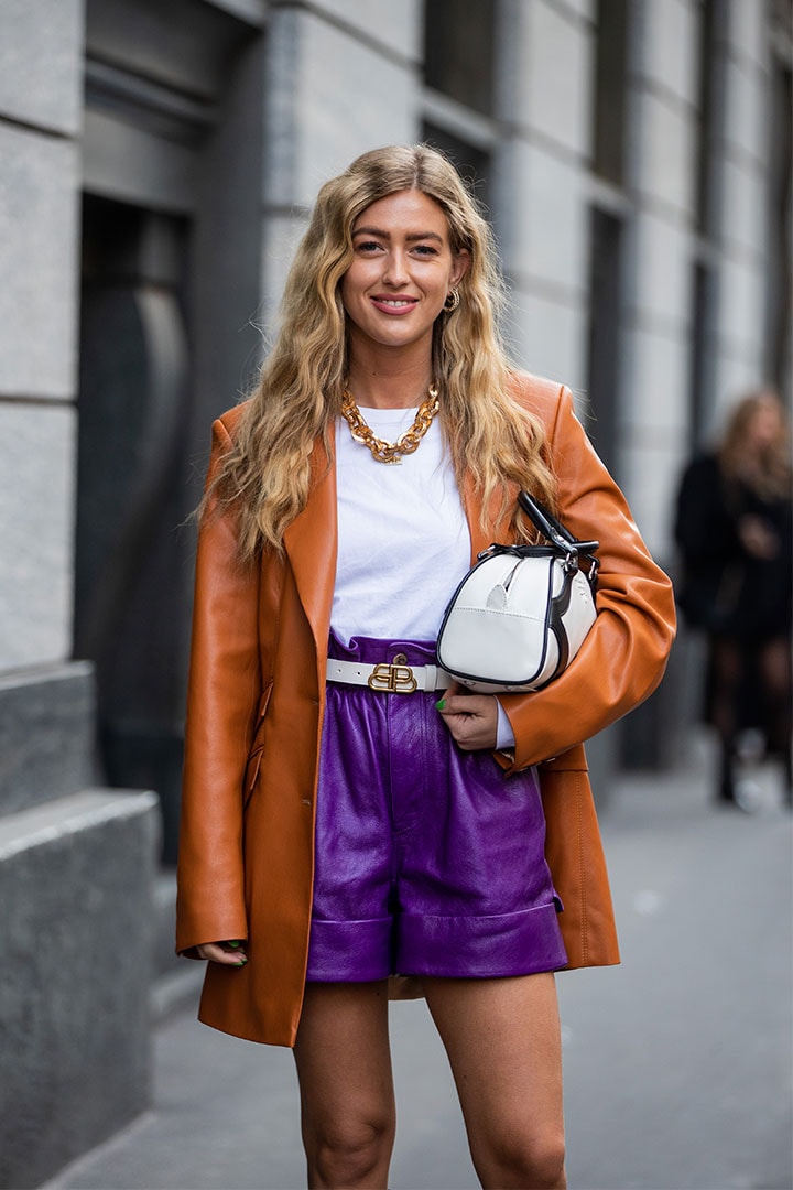 Emili Sindlev is seen wearing purple high waist shorts, rust brown blazer, Prada bag outside Philosophy during Milan Fashion Week Fall/Winter 2020-2021 on February 22, 2020 in Milan, Italy.