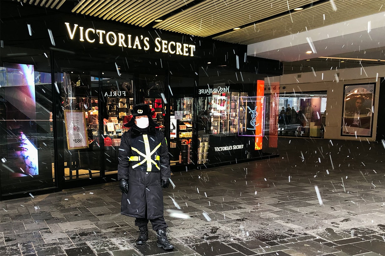 A security staff worker in a facemask stands outside a Victoria's Secret shop; China has witnessed an outbreak of the 2019-nCoV coronavirus, which started in Wuhan