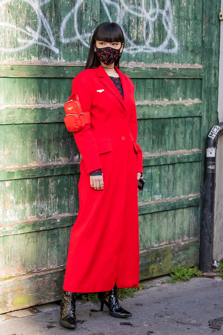 Kozue Akimoto is seen wearing face mask, red coat outside Marine Serre during Paris Fashion Week - Womenswear Fall/Winter 2020/2021 : Day Two on February 25, 2020 in Paris, France.