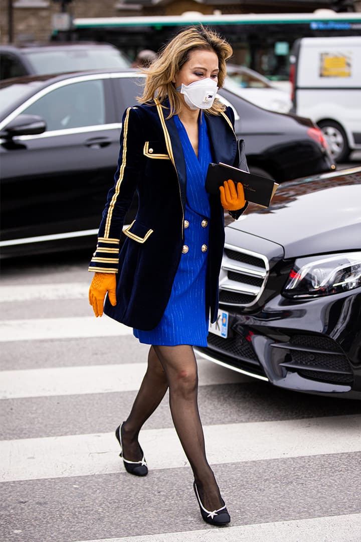 A guest, wearing mask, is seen outside Balmain fashion show on February 28, 2020 in Paris, France.