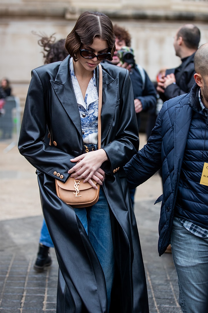 Kaia Gerber is seen wearing YSL bag, black coat, denim jeans outside Chloe during Paris Fashion Week Womenswear Fall/Winter 2020/2021 : Day Four on February 27, 2020 in Paris, France.