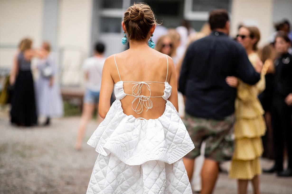 Jenny Walton wearing backless white dress is seen outside Cecilie Bahnsen during the Copenhagen Fashion Week Spring/Summer 2019 on August 8, 2018 in Copenhagen, Denmark.
