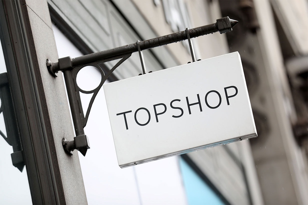 A logo is pictured on a sign outside a Topshop store, operated by Arcadia, in London on June 12, 2019. - Landlords and other creditors were on Wednesday set to vote on revised proposals to billionaire Philip Green's Arcadia retail empire, which includes the high-street brands Topshop, Miss Selfridge, Burton, Dorothy Perkins, Evans and Wallis. (Photo by ISABEL INFANTES / AFP)