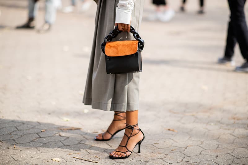 Storm Westphal wearing rey skirt, whit blouse, two tone bag is seen outside Holzweiler during the Copenhagen Fashion Week Spring/Summer 2019 on August 8, 2018 in Copenhagen, Denmark.