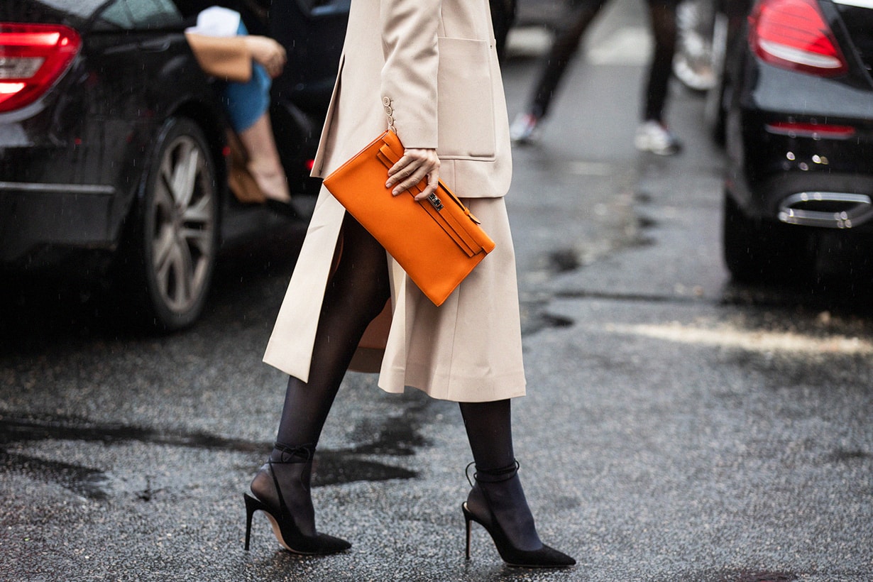 Ece Sukan is seen wearing beige blazer and skirt, orange bag outside Stella McCartney during Paris Fashion Week - Womenswear Fall/Winter 2020/2021 : Day Eight on March 02, 2020 in Paris, France.