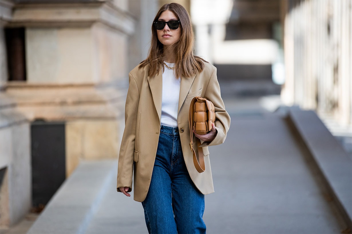 Swantje Soemmer is seenwearing beige blazer Arket, denim jeans Arket, brown bag Bottega Veneta, Ray Ban sunglasses on May 21, 2020 in Berlin, Germany.