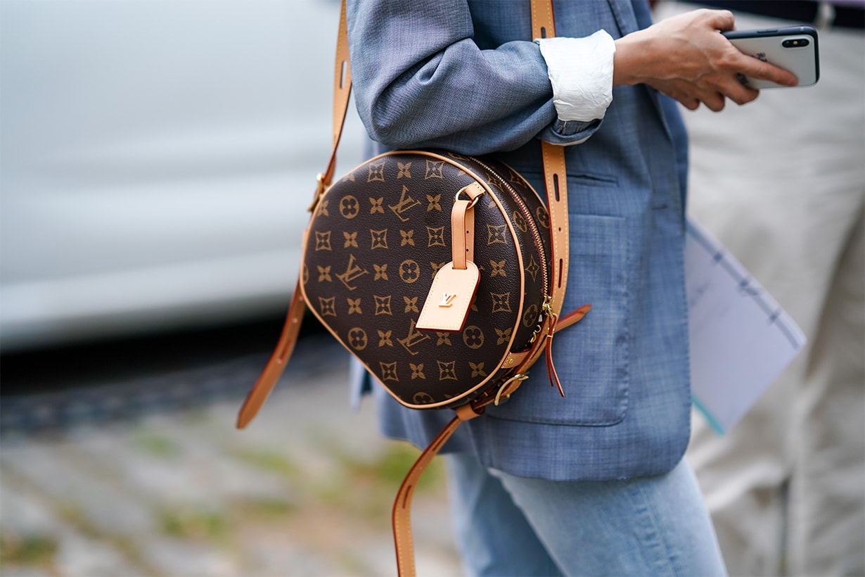 A guest wears a light blue jacket, a Louis Vuitton monogram bag, outside Hermes, during Paris Fashion Week - Menswear Spring/Summer 2020, on June 22, 2019 in Paris, France. 