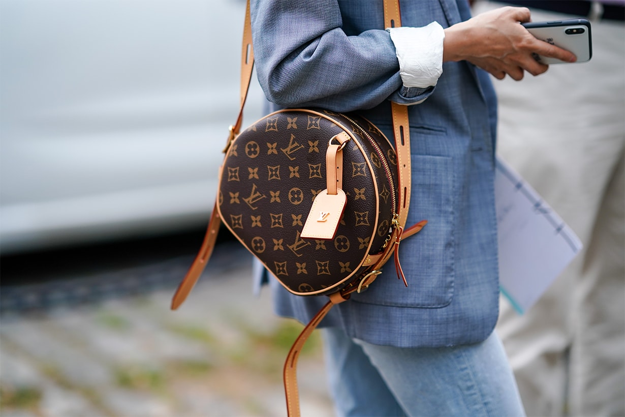 A guest wears a light blue jacket, a Louis Vuitton monogram bag, outside Hermes, during Paris Fashion Week - Menswear Spring/Summer 2020, on June 22, 2019 in Paris, France.