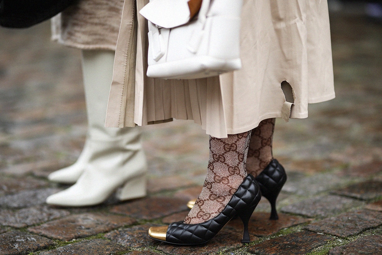 Fashion Week guest wearing Gucci socks and Bottega Veneta bag and heels before Mykke Hofmann on January 28, 2020 in Copenhagen, Denmark.