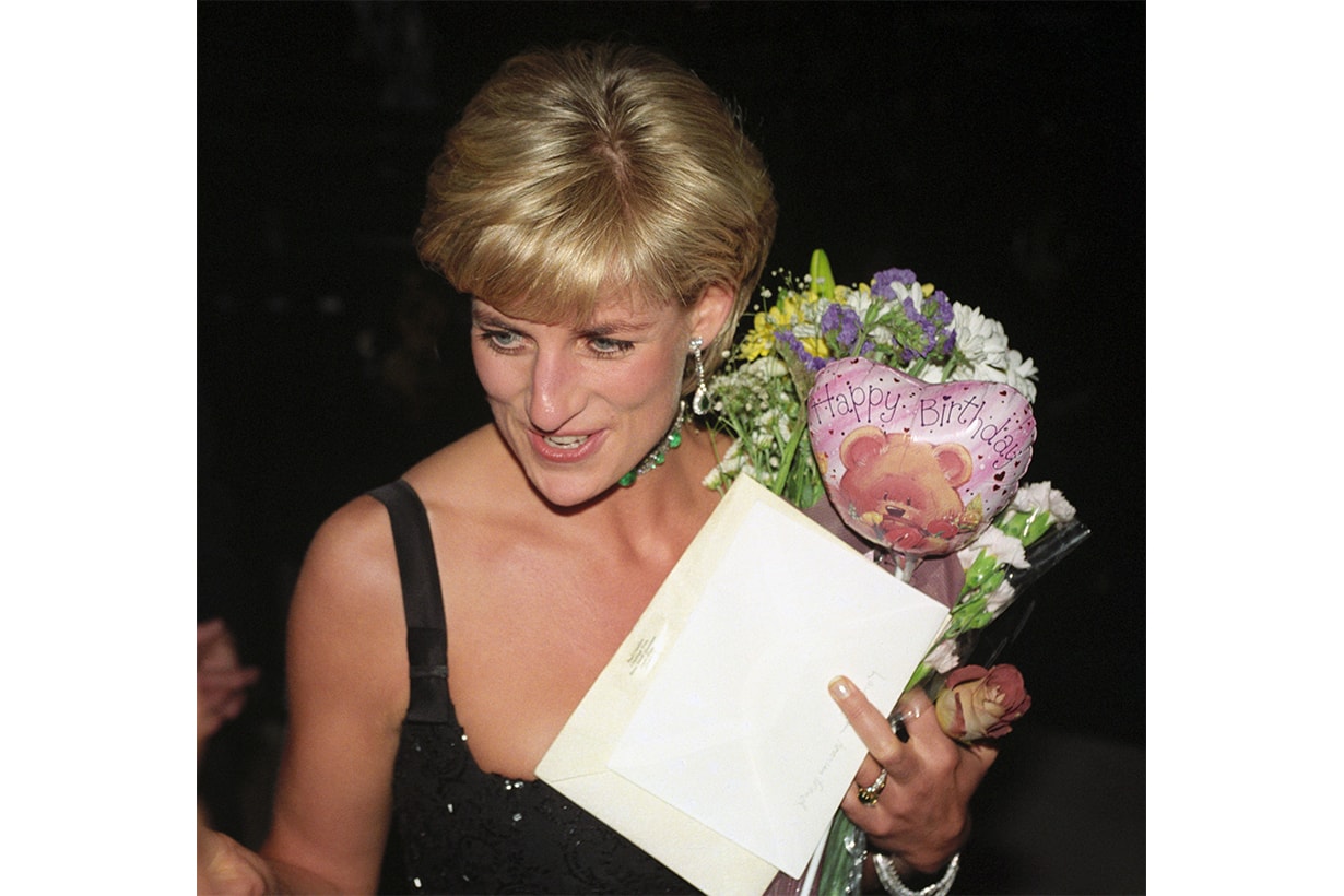 Diana, Princess of Wales, leaves the Tate Gallery's Centenary Gala Dinner carrying birthday gifts she received from friends for her 36th birthday.