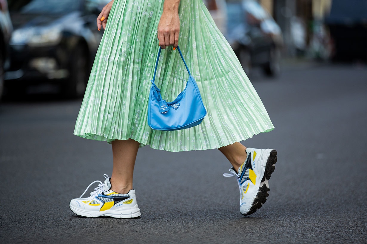 Sonia Lyson is seen wearing sneaker Axel Arigato, mint pleated skirt &other stories, blue bag Prada on July 29, 2020 in Berlin, Germany.