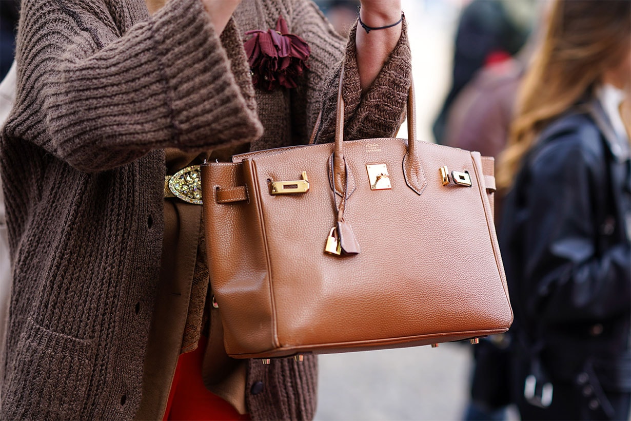 A guest wears a brown leather Hermes bag, outside Vivetta, during Milan Fashion Week Fall/Winter 2020-2021 on February 20, 2020 in Milan, Italy.
