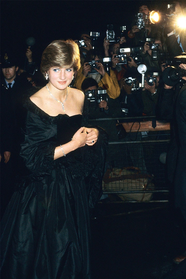Lady Diana Spencer, later to become Diana, Princess of Wales wears a revealing Emanuel black dress as she attends her first official engagement with Prince Charles at a fundraising concert at the Goldsmiths Hall on March 15, 1982 in London, England.