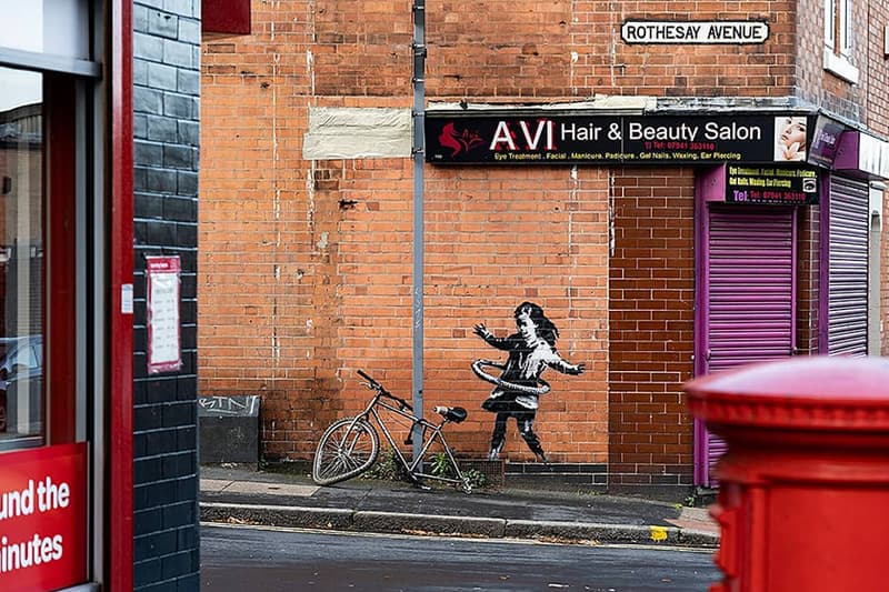 banksy nottingham hula hooping girl with tire artwork