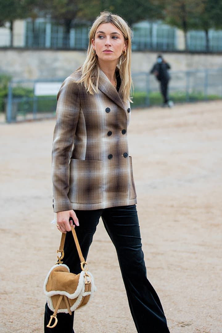 Camille Charriere seen wearing blazer, Dior bag outside Dior during Paris Fashion Week - Womenswear Spring Summer 2021 : Day Two on September 29, 2020 in Paris, France.