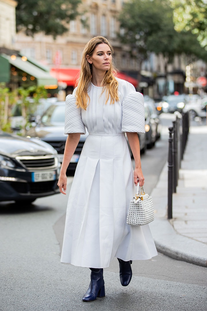 A guest is seen wearing white dress, Fendi bag outside Paco Rabanne during Paris Fashion Week - Womenswear Spring Summer 2021 : Day Seven on October 04, 2020 in Paris, France.