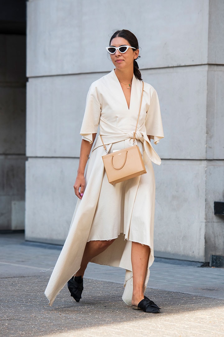 News and Features editor for WWD Natalie Theodosi wears a Medea bag, Mango dress, Mango shoes and Les Specs sunglasses during LFW September 2020 at on September 18, 2020 in London, England.