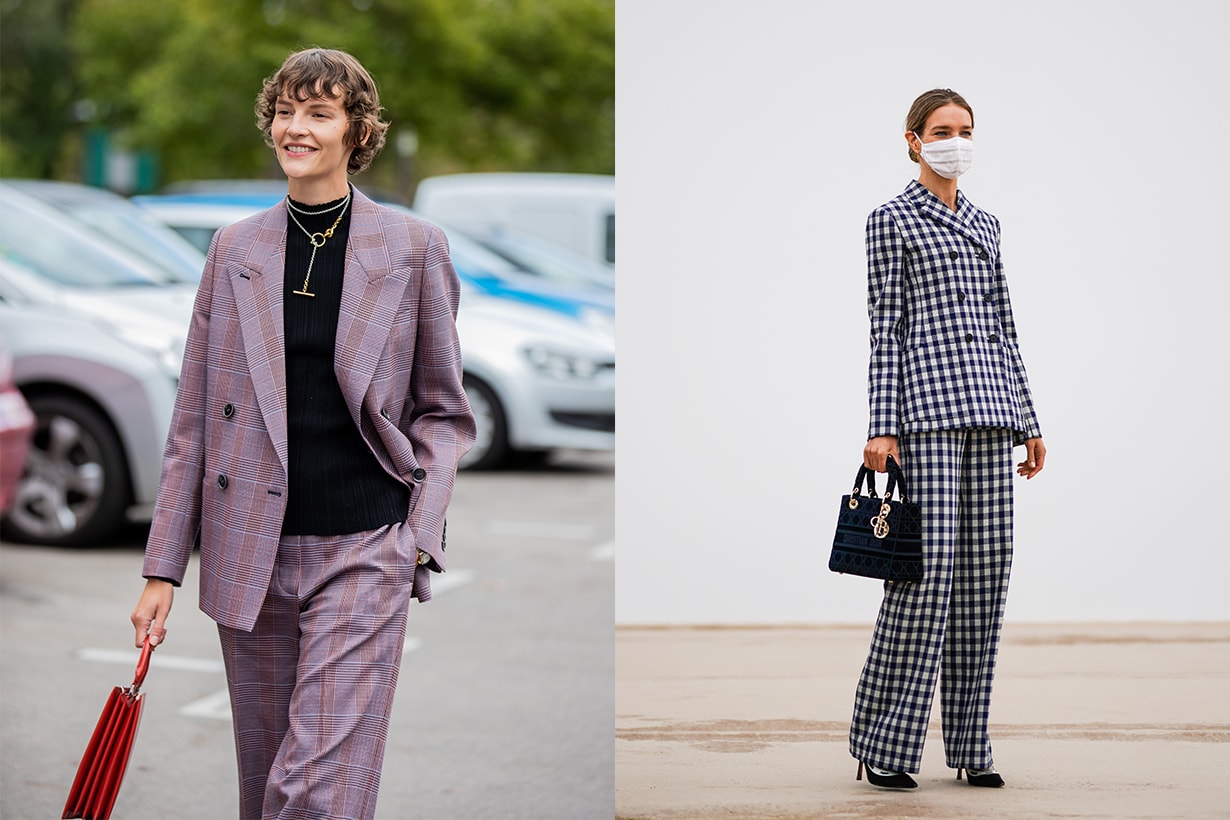 Natalia Vodianova wears a white protective face mask, a black and white checked blazer jacket, a Dior Lady Dior bag, flared pants, J'Adior pointy shoes, outside Dior, during Paris Fashion Week - Womenswear Spring Summer 2021 on September 29, 2020 in Paris, France.