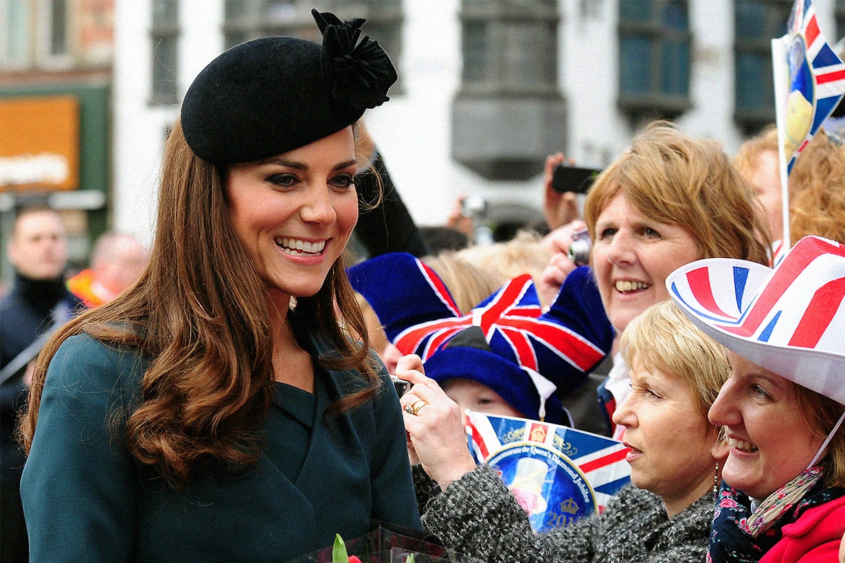 Britain's Catherine, The Duchess of Cambridge visits the city of Leicester in central England, on March 8, 2012, with Queen Elizabeth II and Prince Philip (not pictured). Queen Elizabeth II was welcomed by a cheering crowd of thousands Thursday as she began her diamond jubilee tour of Britain accompanied by Prince William's wife Catherine. AFP PHOTO / RUI VIEIRA/POOL (Photo by RUI VIEIRA / AFP)